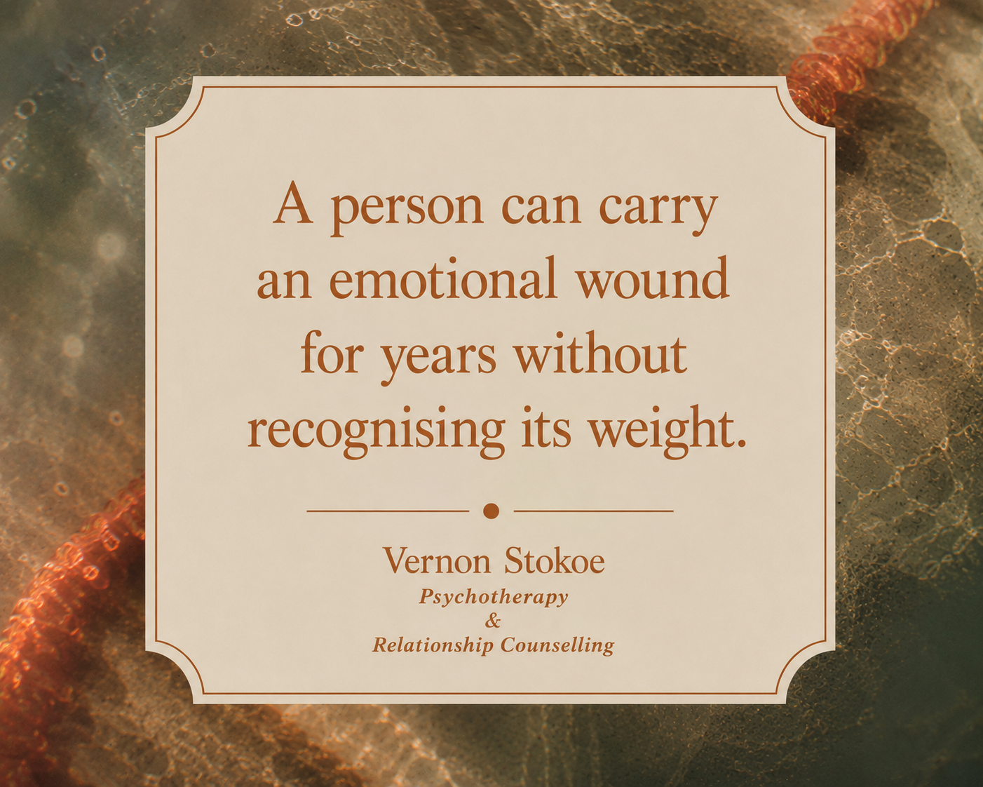Psychotherapy quote graphic with warm orange typography over abstract water textures and blurred amber reflections, featuring the text “A person can carry an emotional wound for years without recognising its weight.”